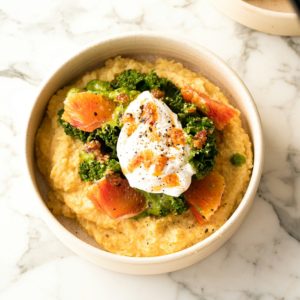a bowl of food on a marble table